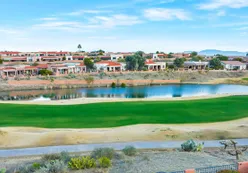 Golf course with community in background