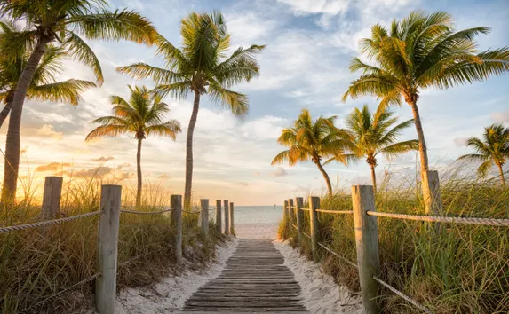 A footbridge to Smathers Beach at sunrise in Key West, Florida.