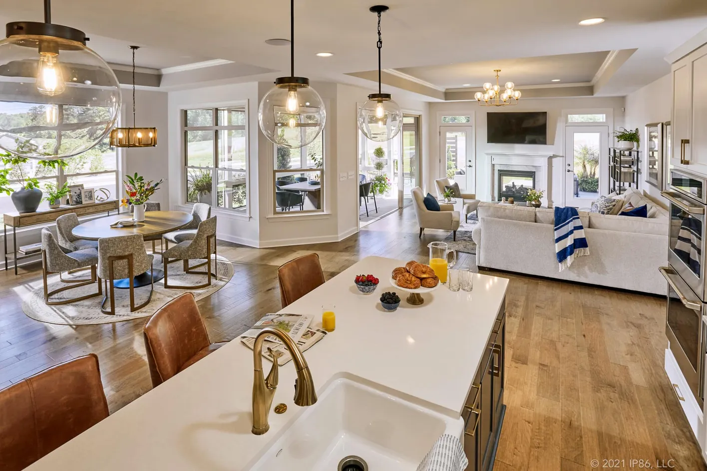 Gourmet kitchen featuring a large island and stylish pendant lighting