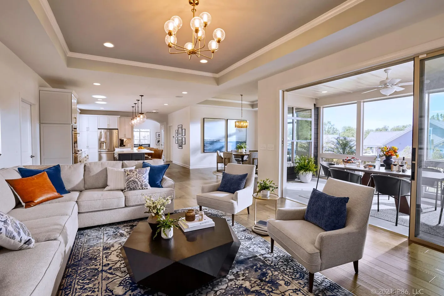 Spacious open-concept layout connecting the kitchen, dining, and living areas
