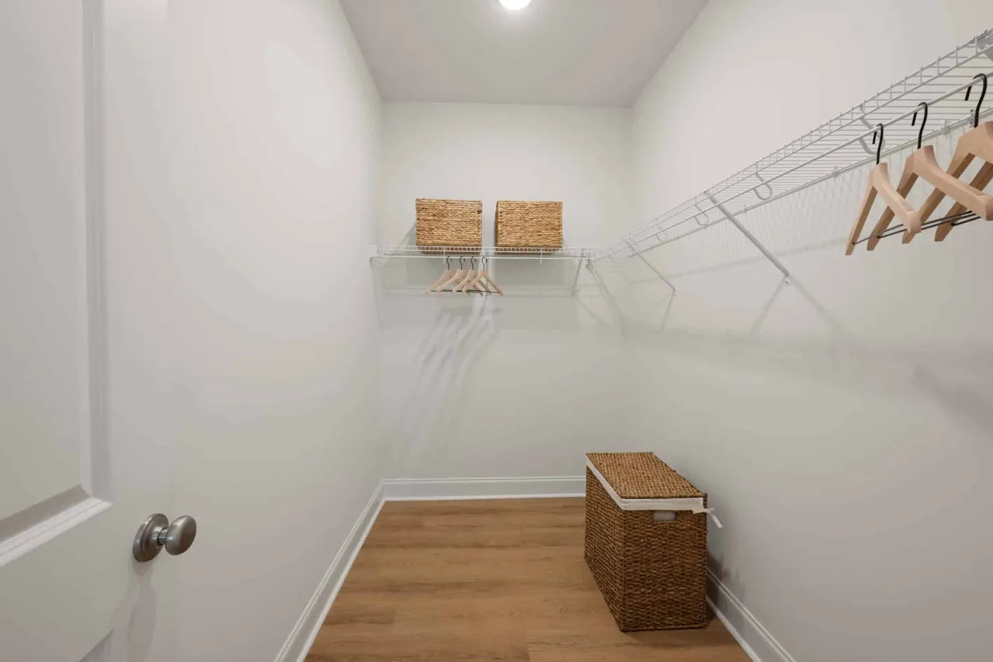 Walk-in closet with shelving and hanging space