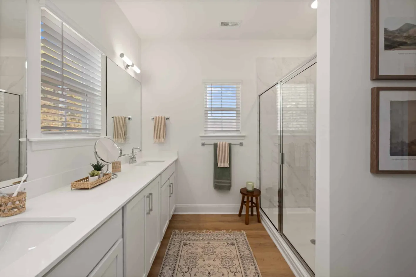 Bathroom with double vanity and glass shower