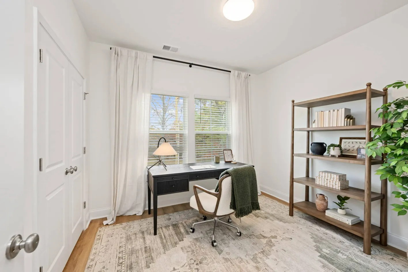 Home office with desk and shelving