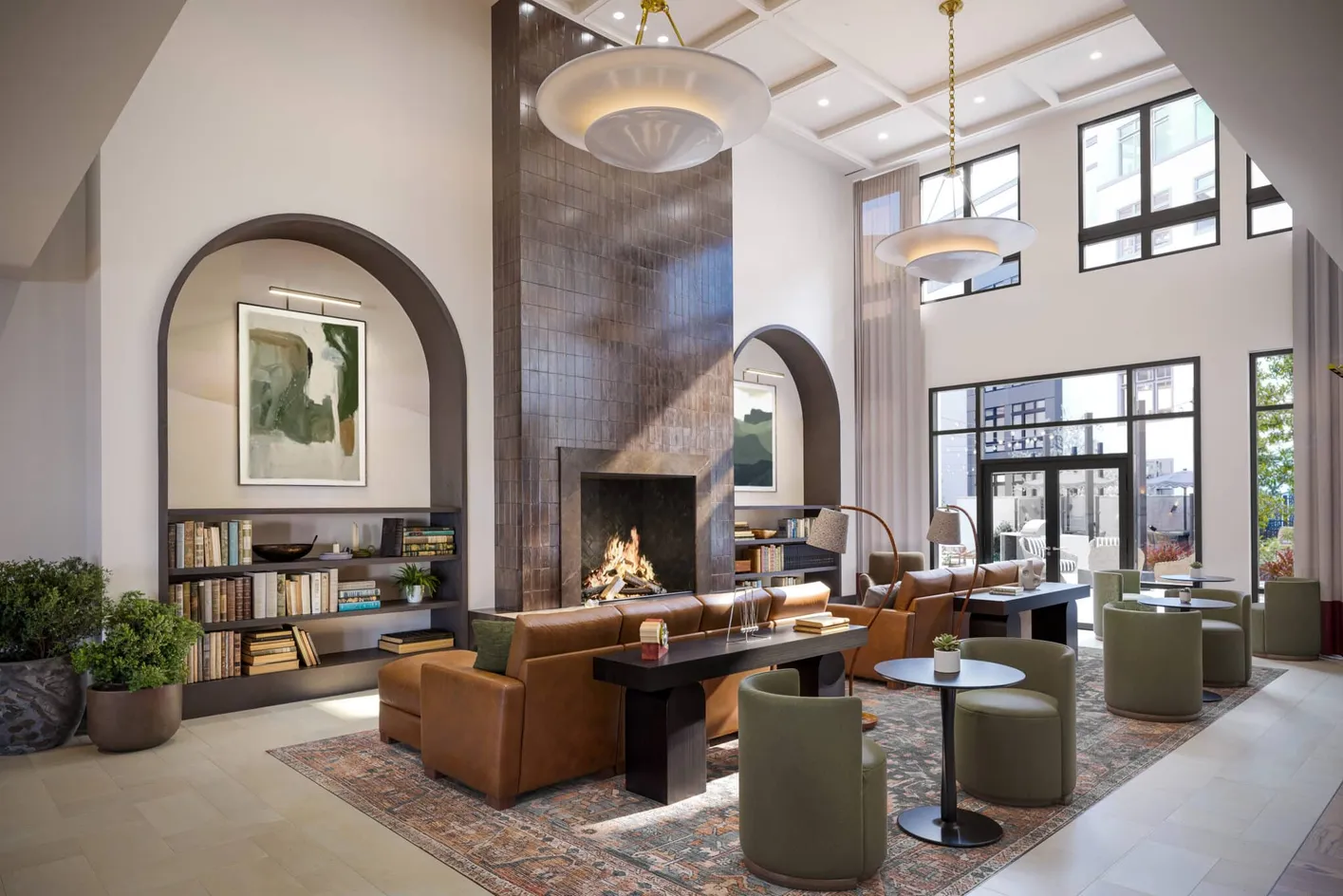 Resident clubroom with lounge seating, entertainment space, and gathering areas.