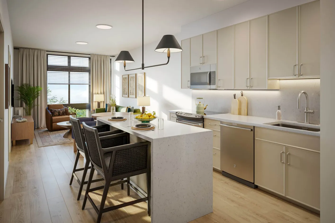 Open-concept apartment kitchen and living area with large windows.