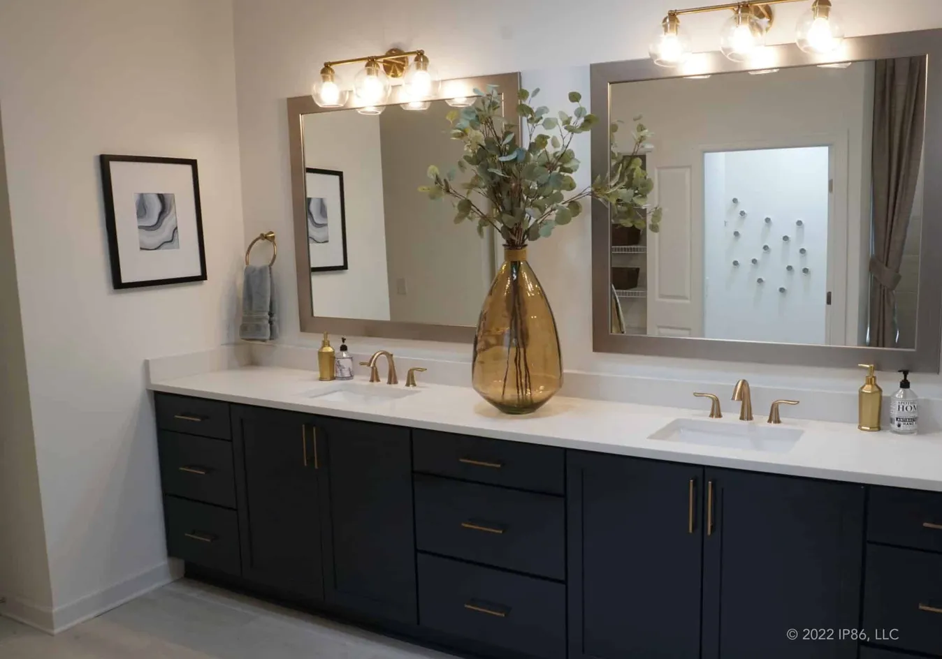 Modern bathroom with dual vanities and sleek finishes