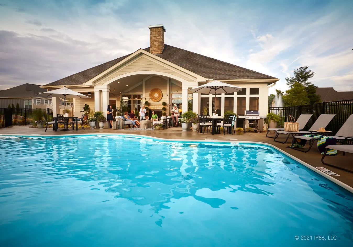 Resort-style outdoor pool and clubhouse gathering space