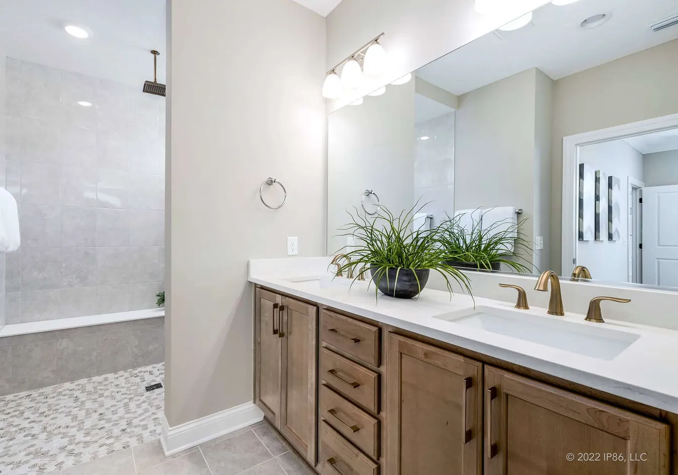 Bathroom vanity with double sinks and large mirror
