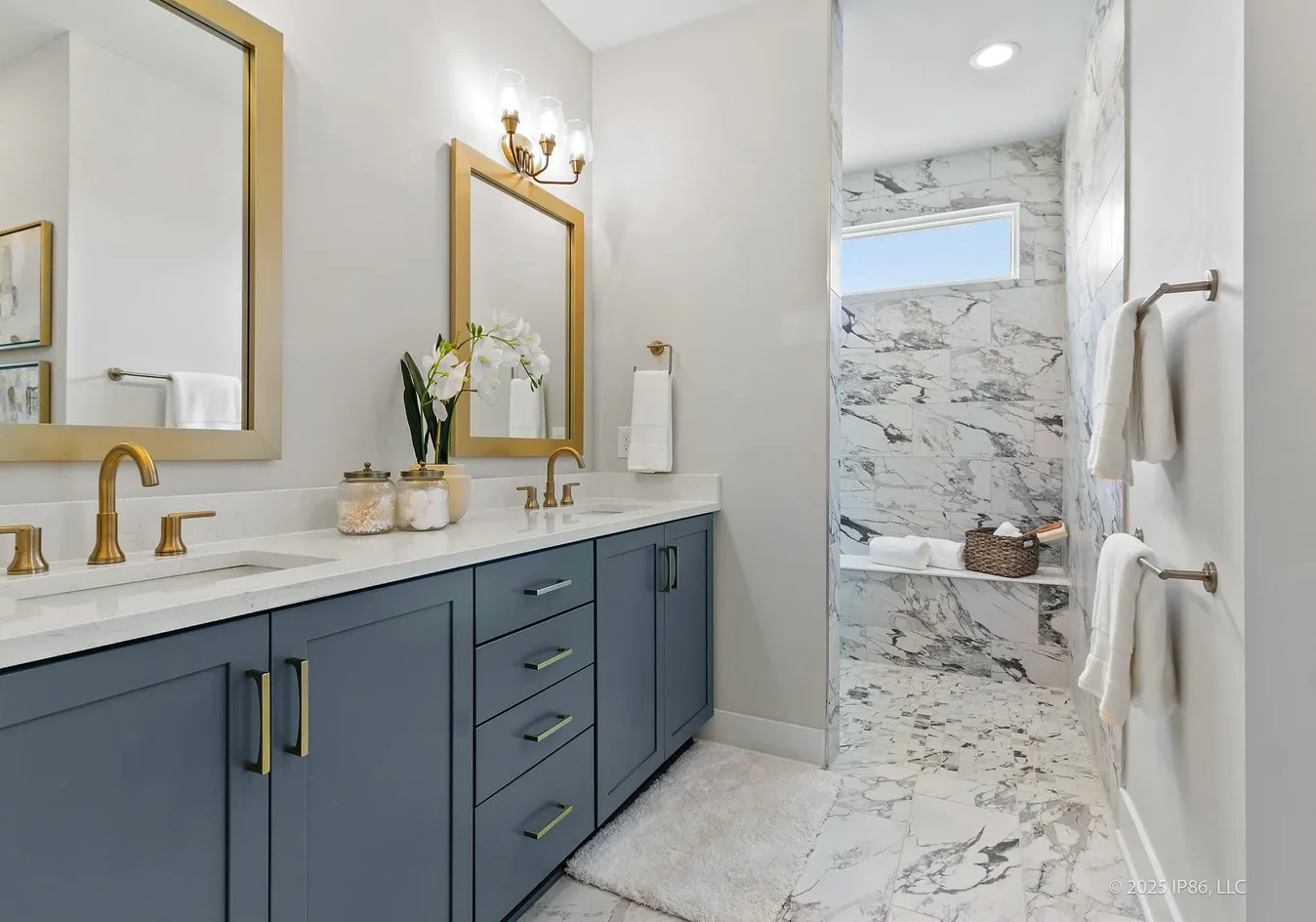 Bathroom with dual sinks and shower