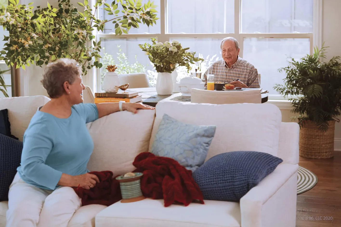 Relaxed living area with residents enjoying a cozy morning