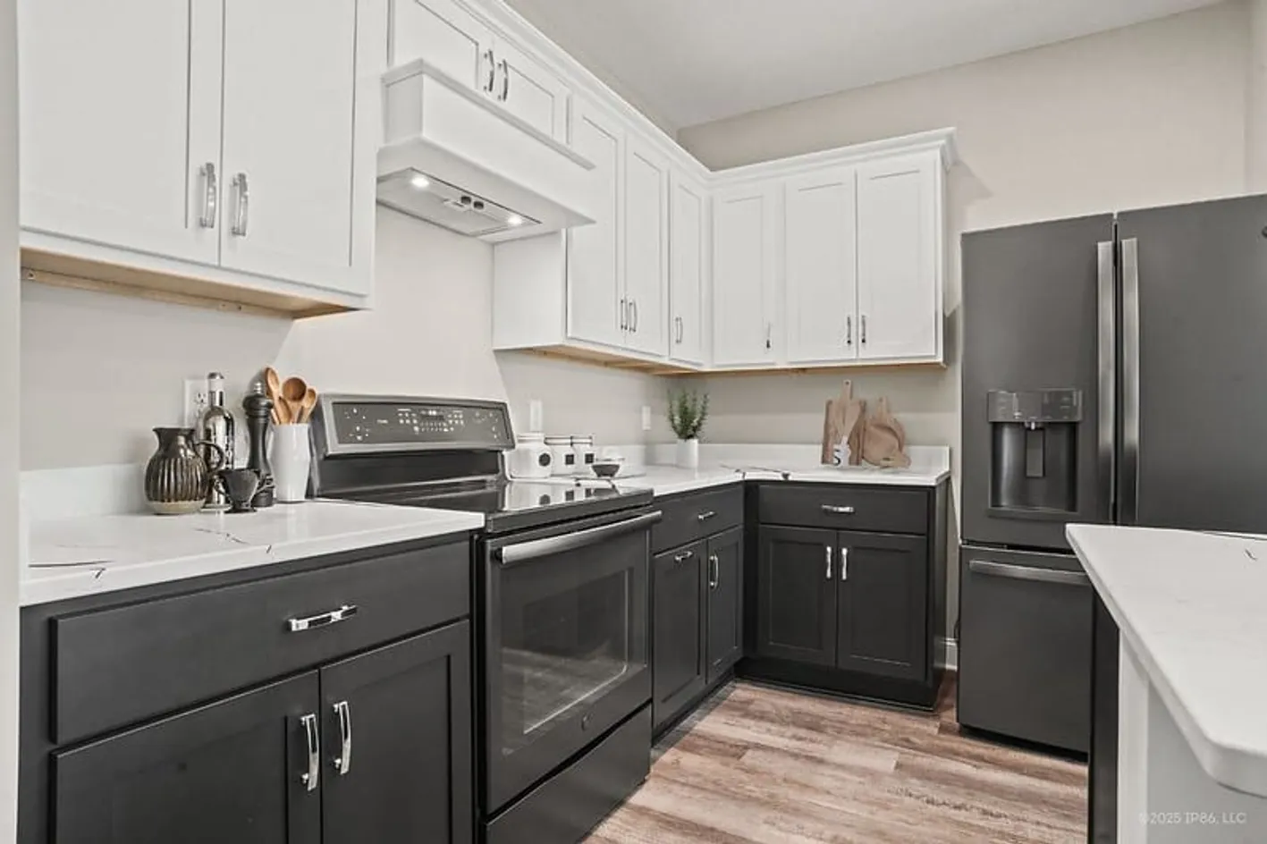 Kitchen with white cabinets and stainless appliances