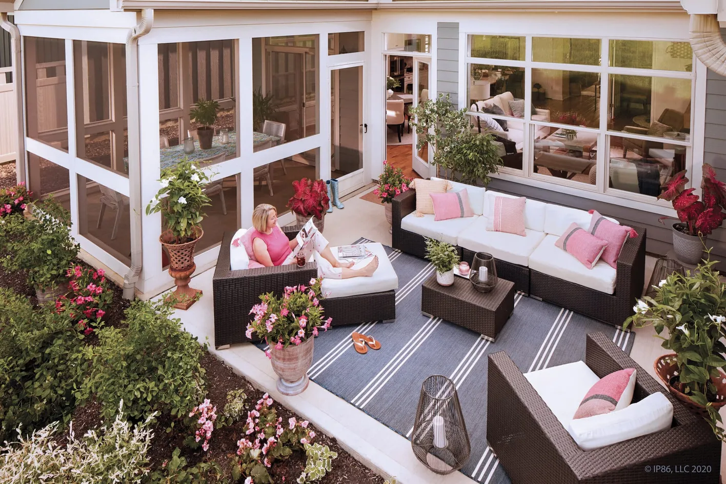 Private courtyard patio with comfortable seating and lush landscaping