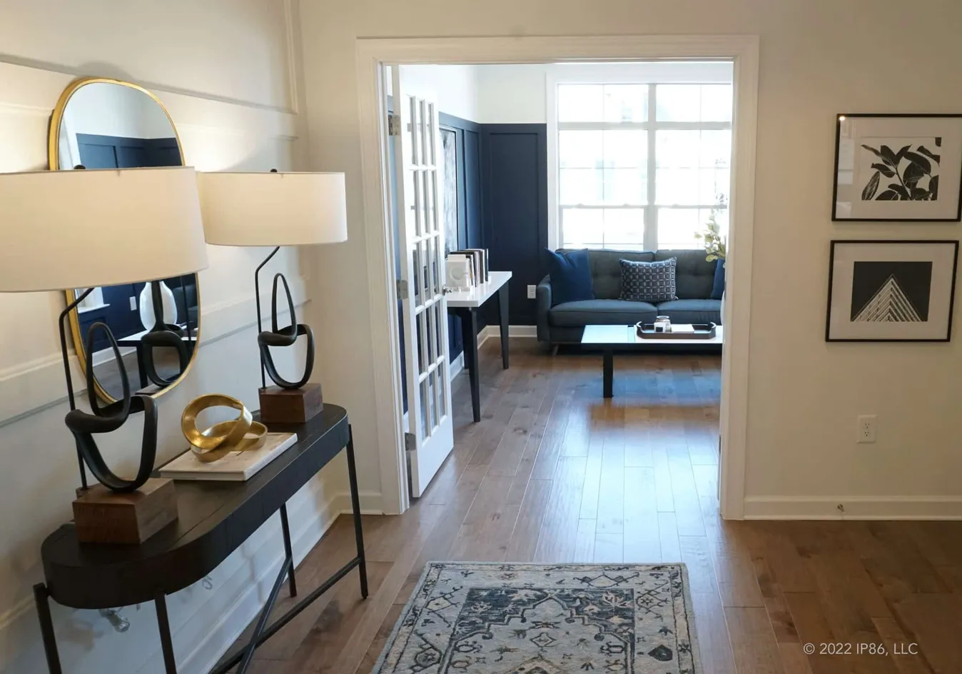 Welcoming entryway leading to a stylish flex space or home office