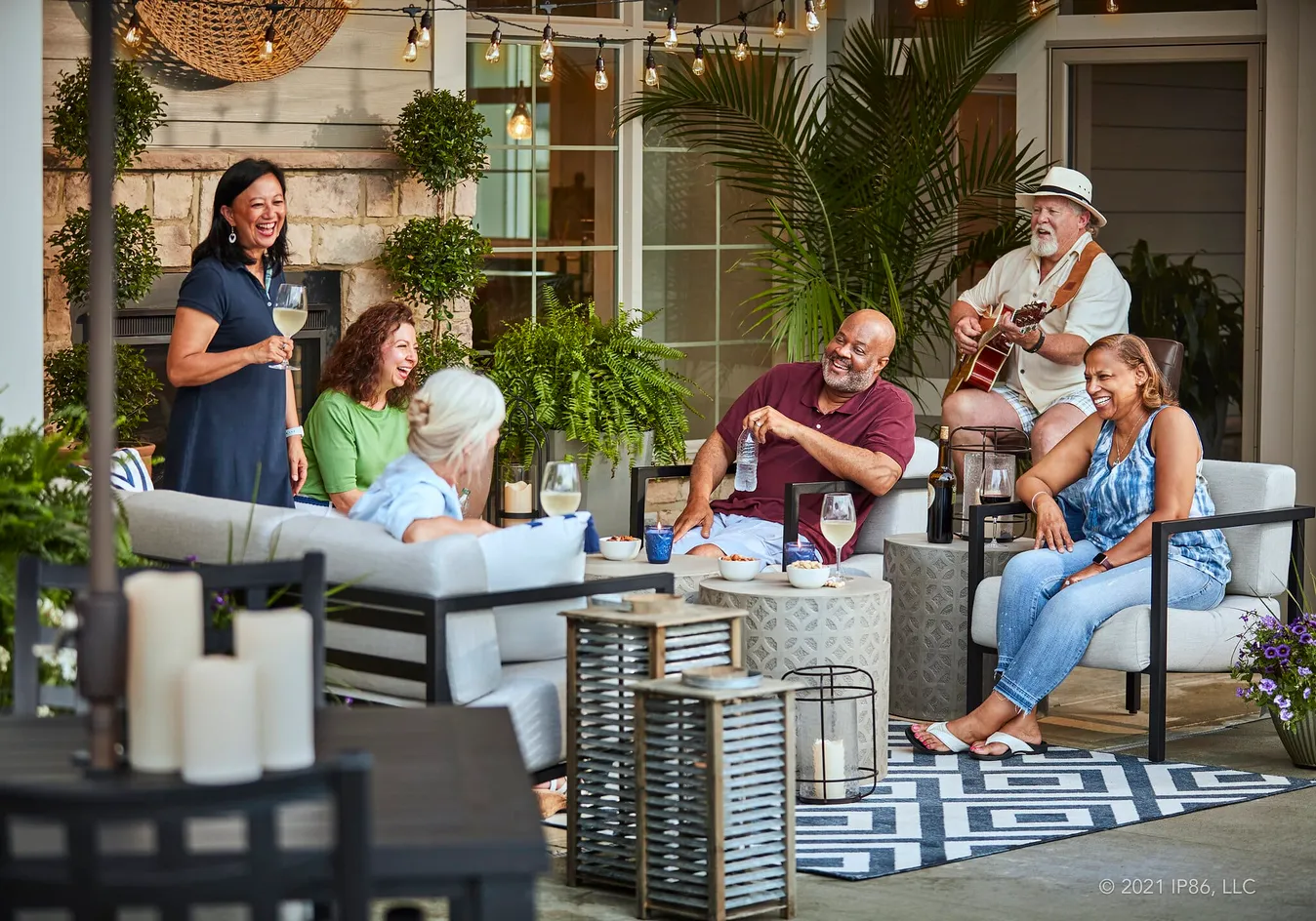 Residents enjoying an outdoor gathering space with live music