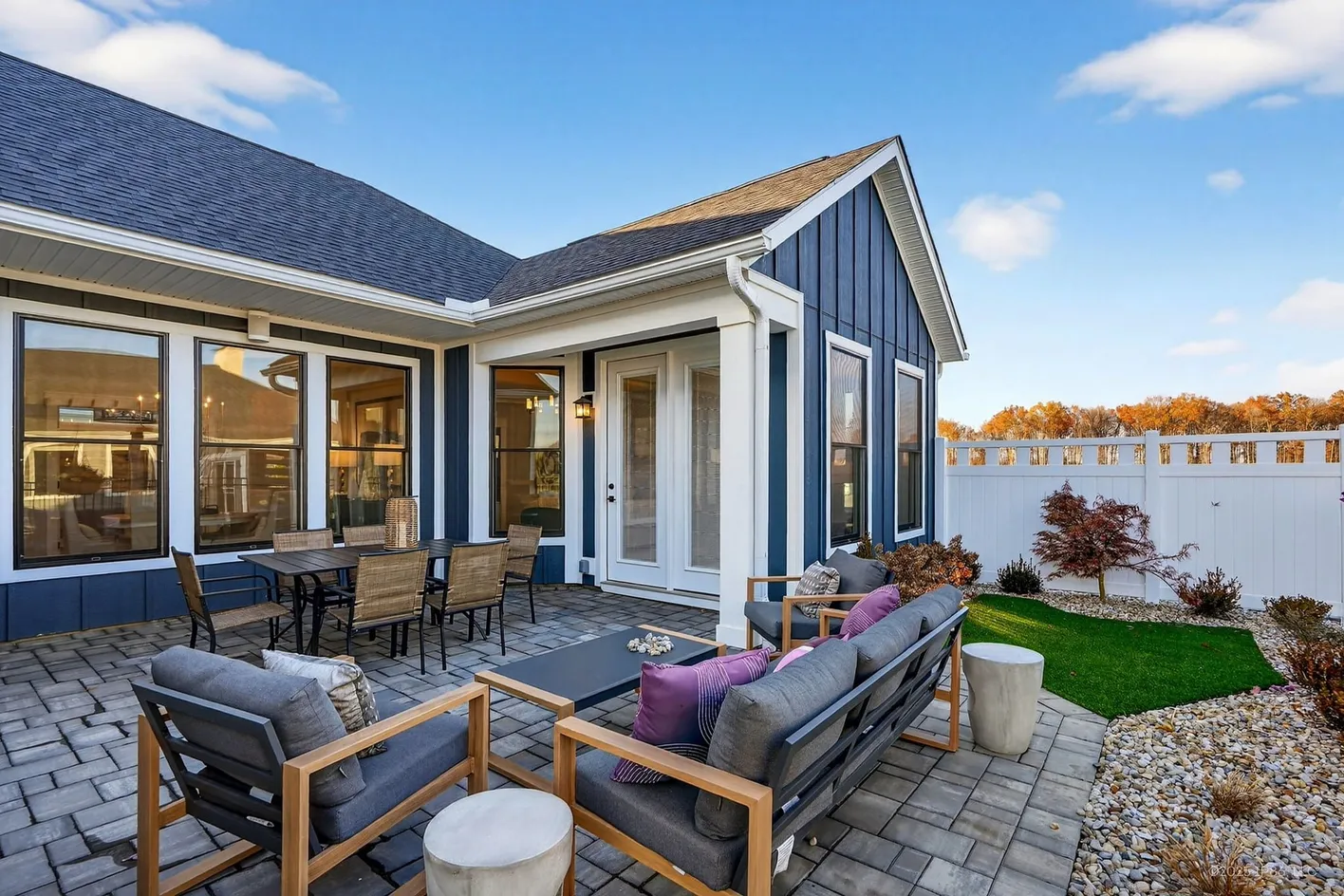 Fenced patio with seating and dining
