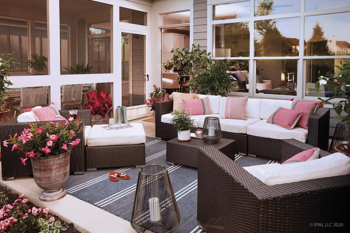 Stylish outdoor courtyard with sectional seating and garden views