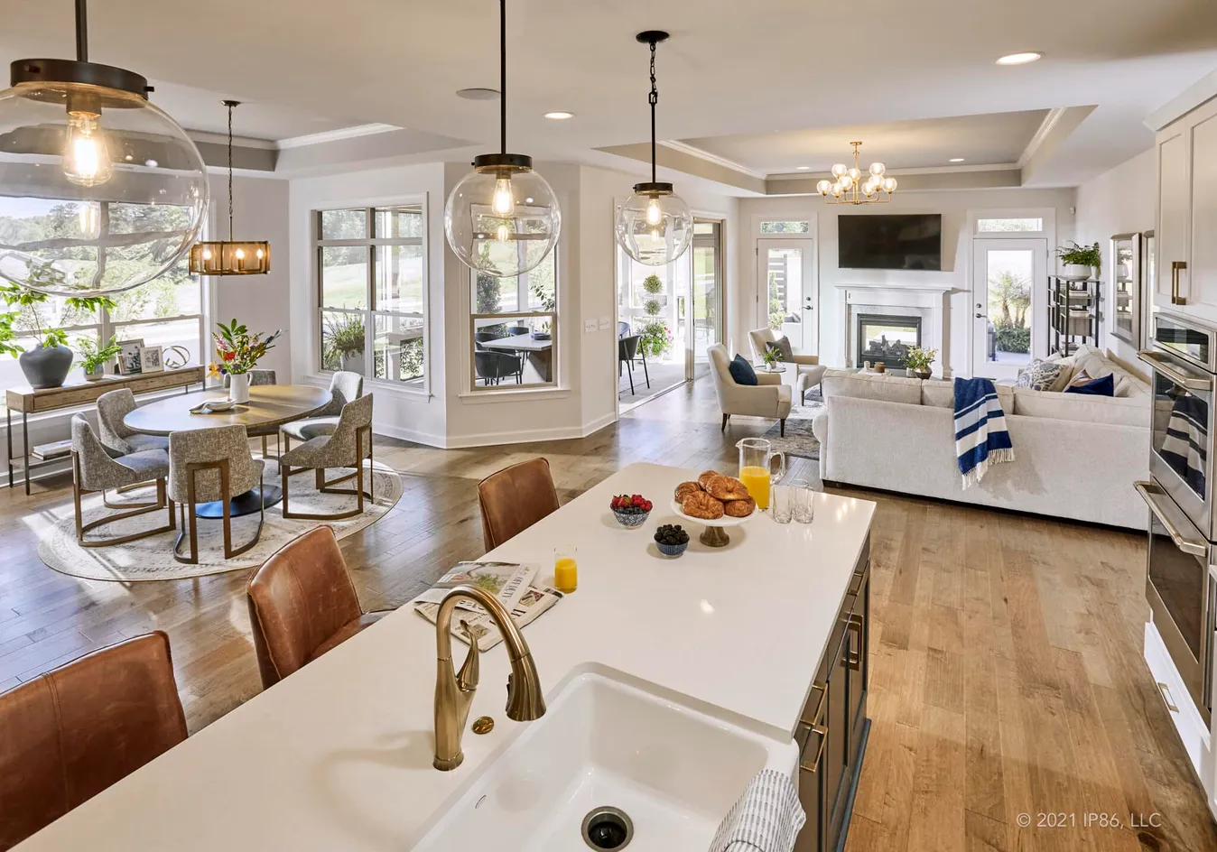 Gourmet kitchen featuring a large island and stylish pendant lighting