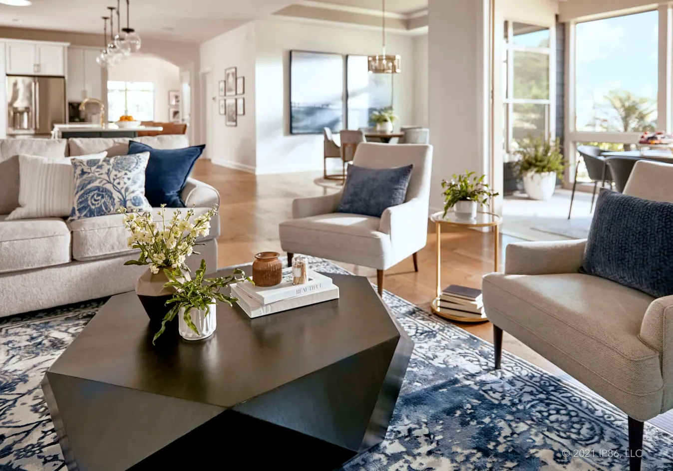 Bright living room with modern furnishings and large windows