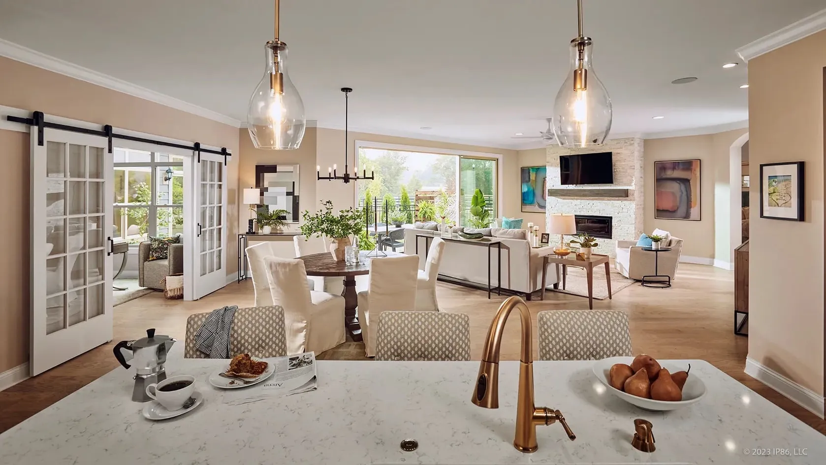 Open-concept living and dining area with expansive patio views