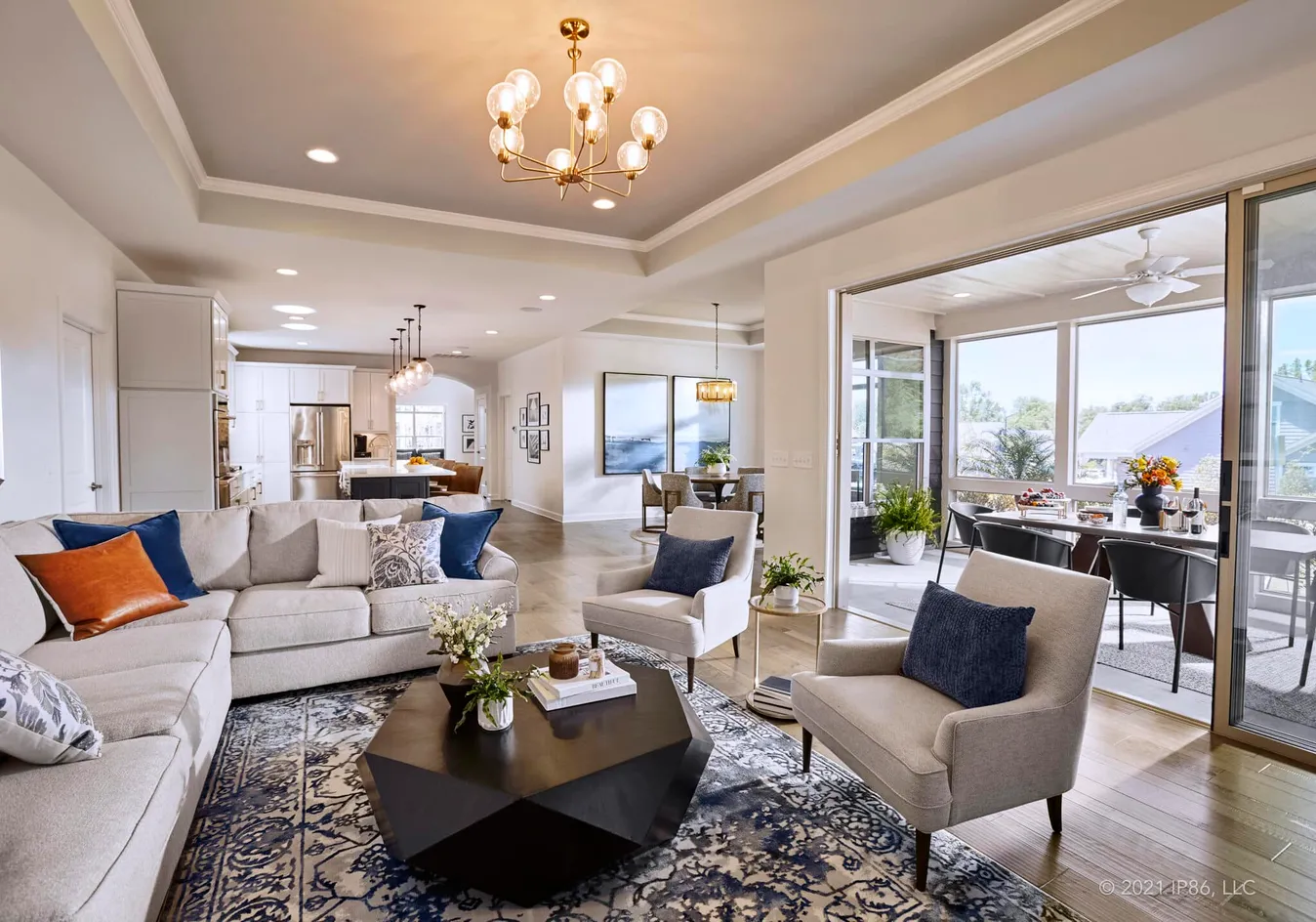 Seamless flow from the living room to the sunroom and outdoor spaces
