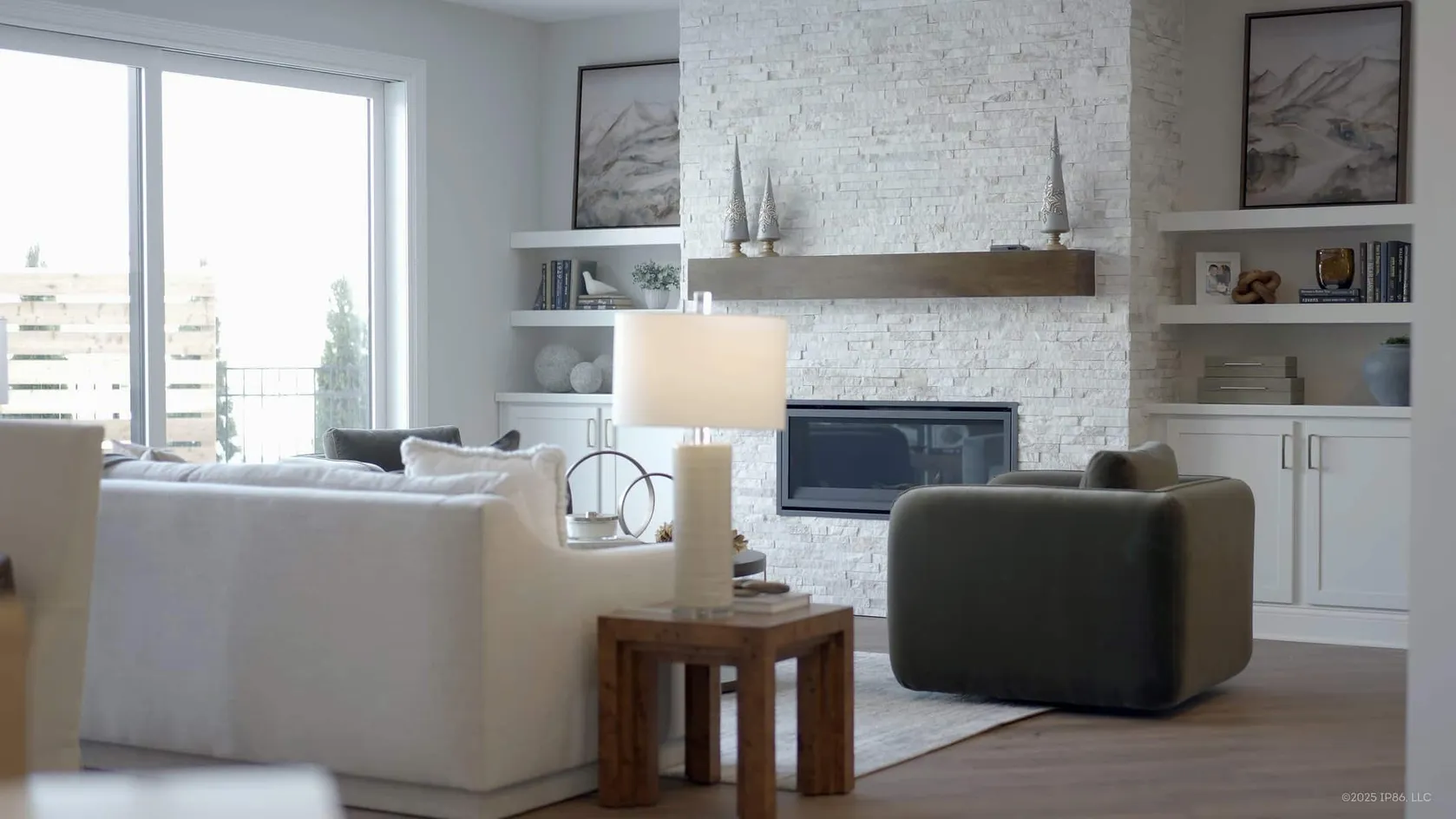 Bright living room with stone fireplace