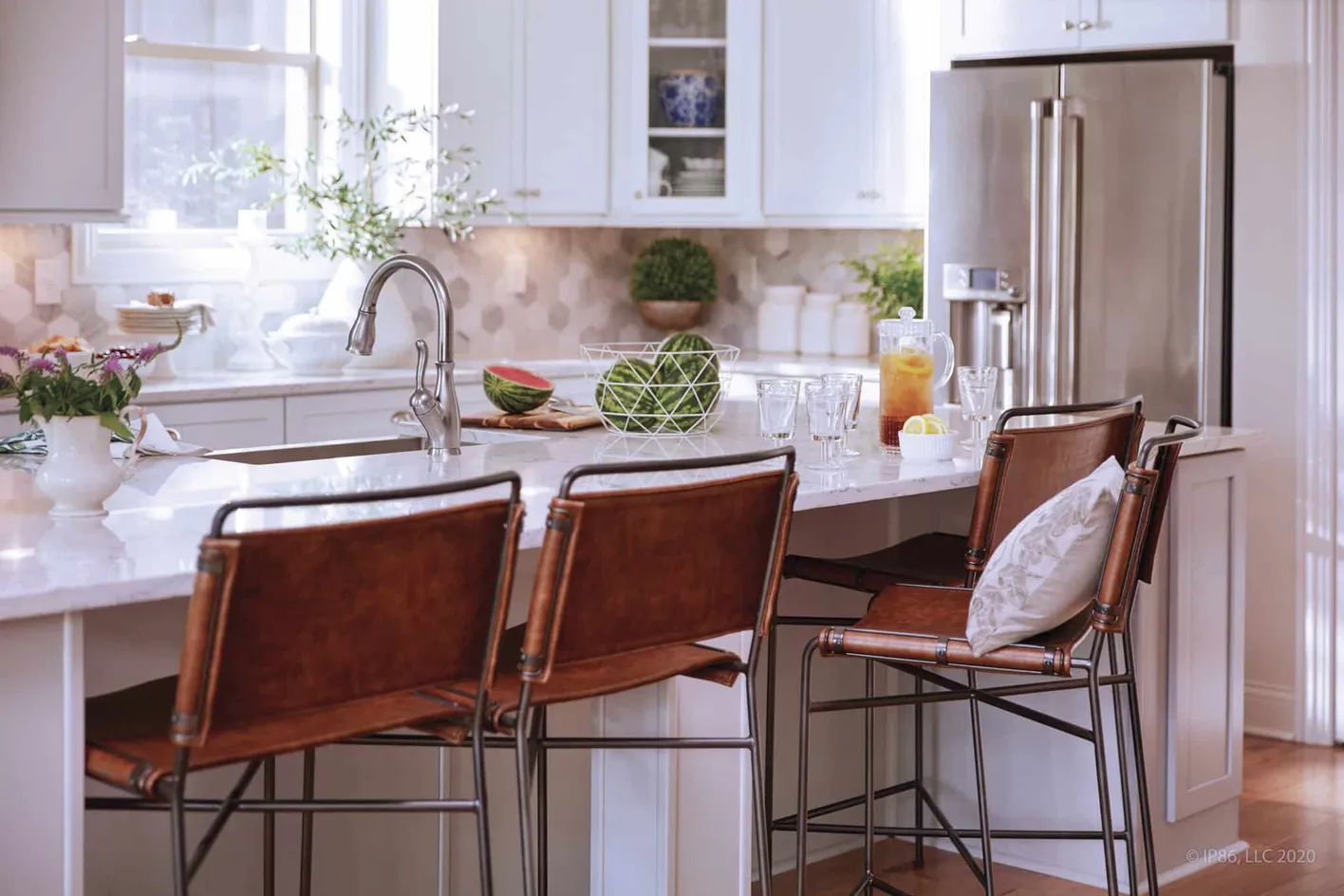 Elegant kitchen with bar seating and stainless steel appliances