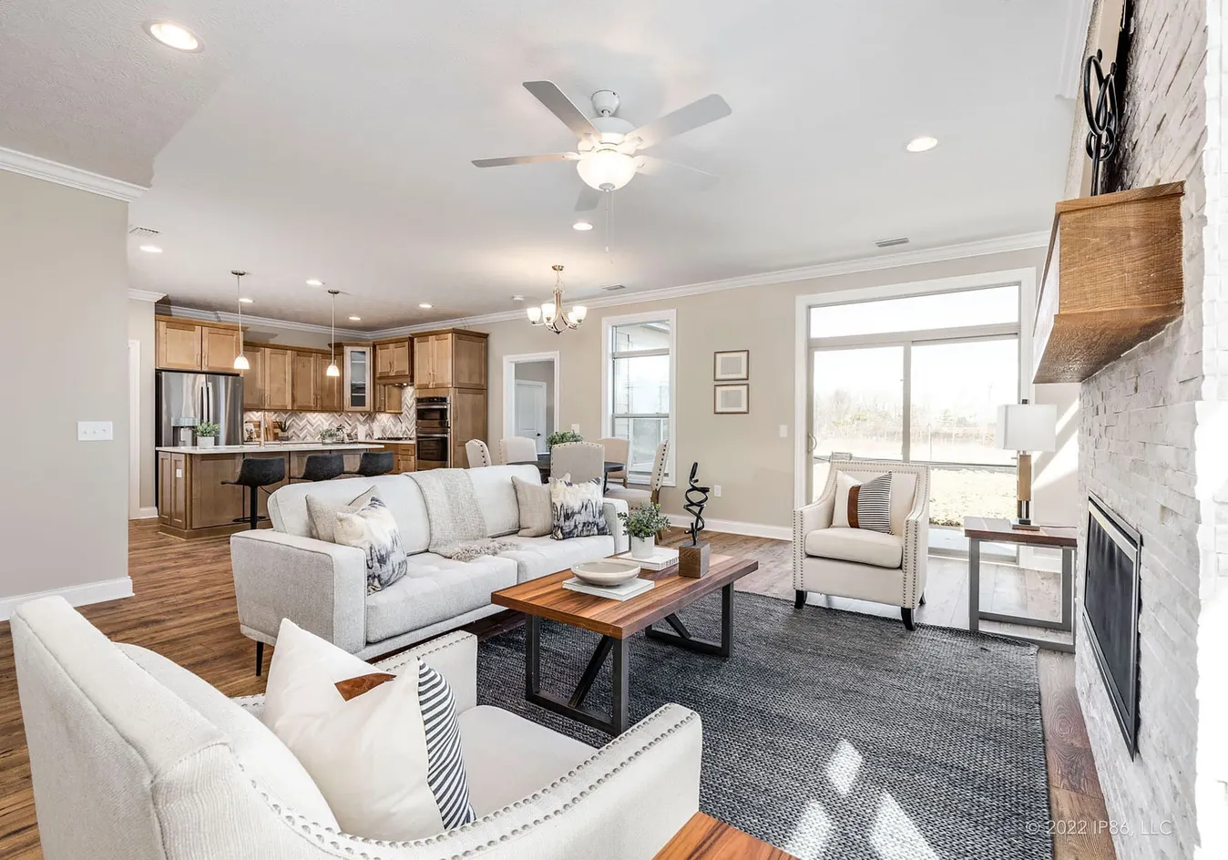 Open living and dining space with fireplace