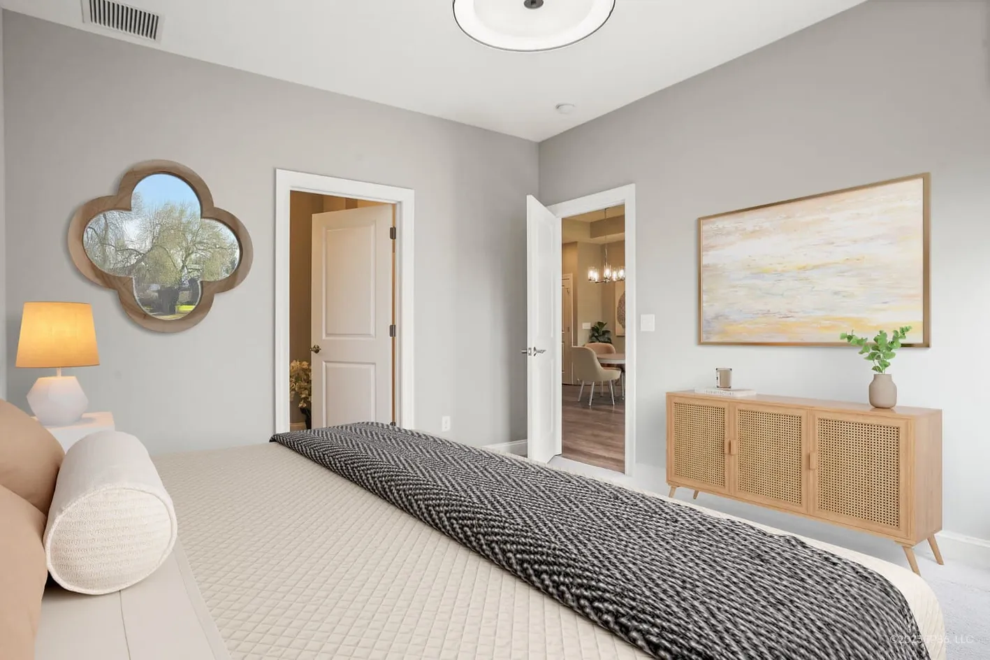 Bedroom with dresser and wall art