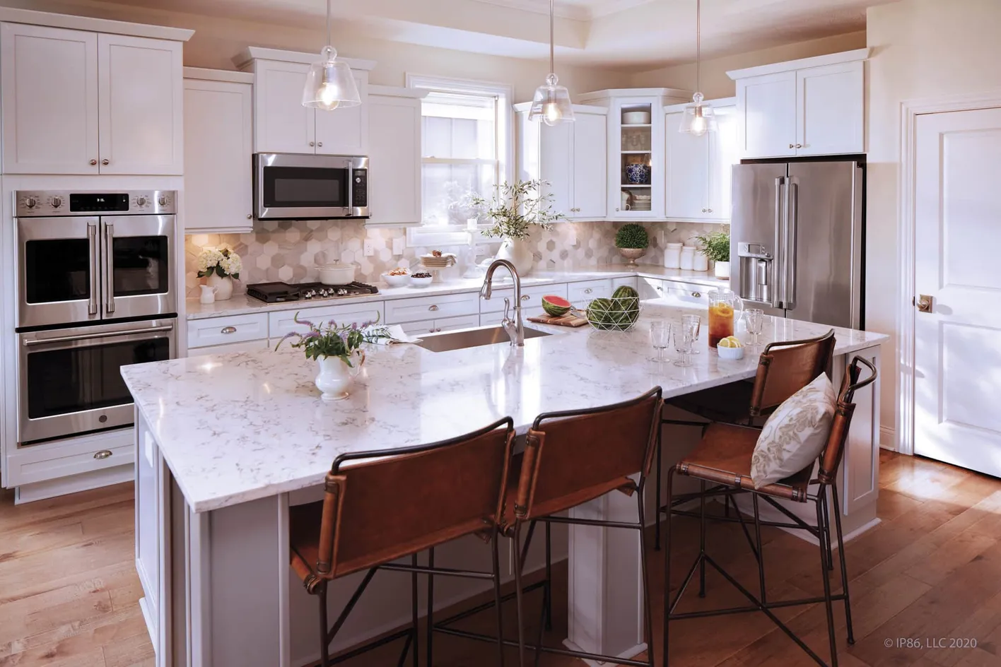 Spacious gourmet kitchen with large island and pendant lighting