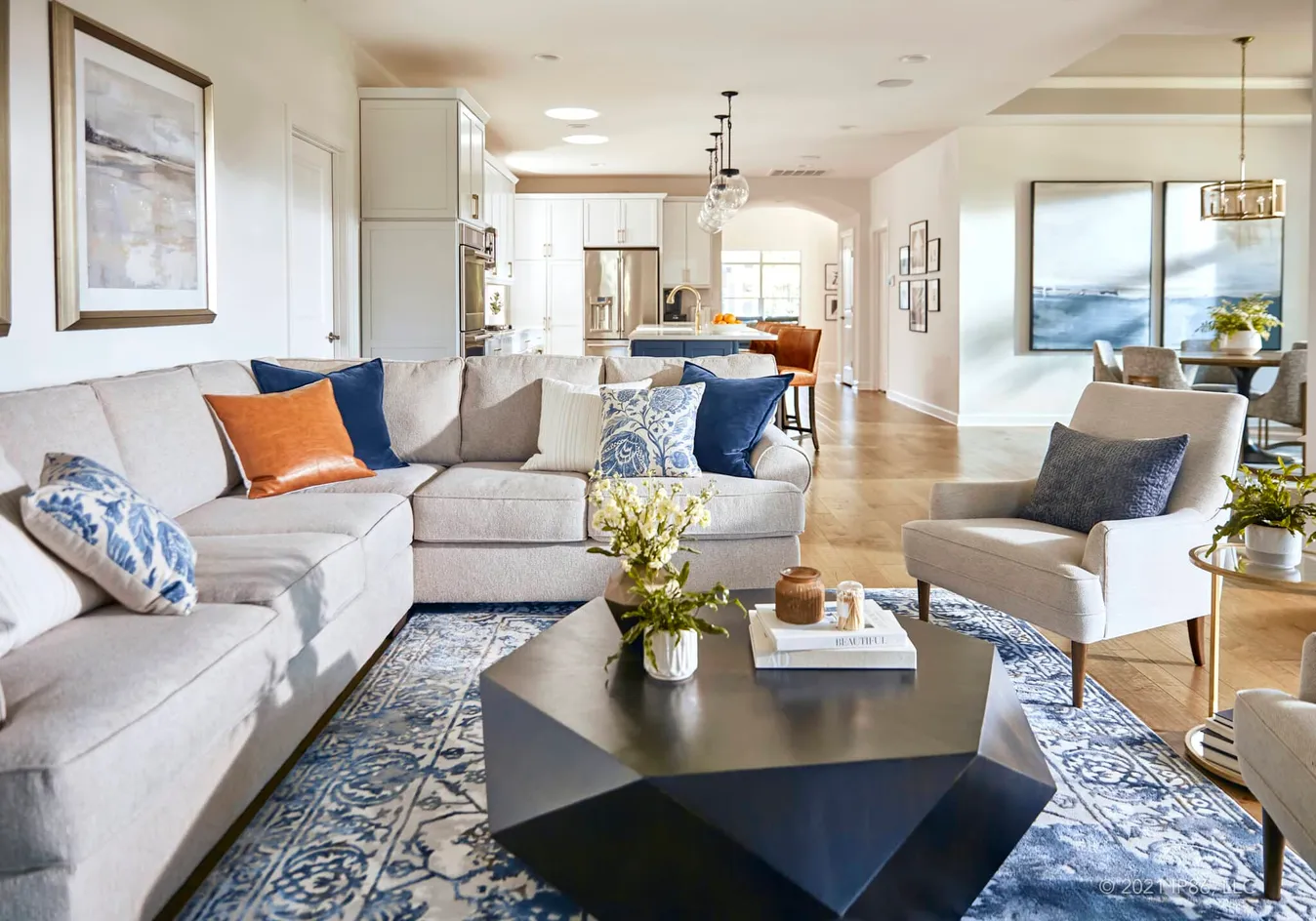 Spacious open-concept layout connecting the kitchen, dining, and living areas
