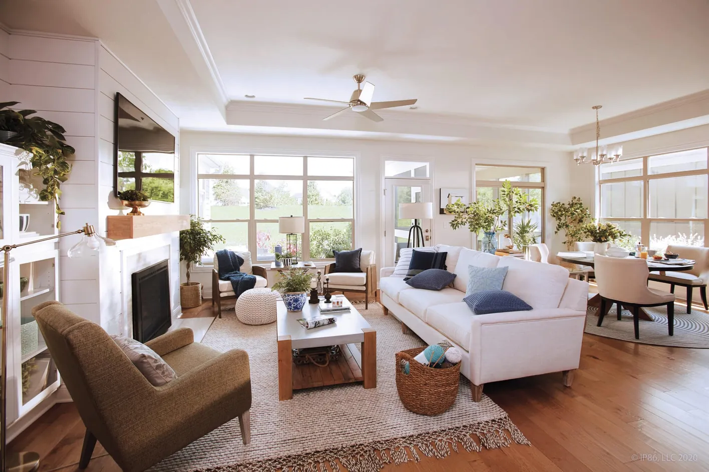 Open-concept living room filled with natural light and modern decor