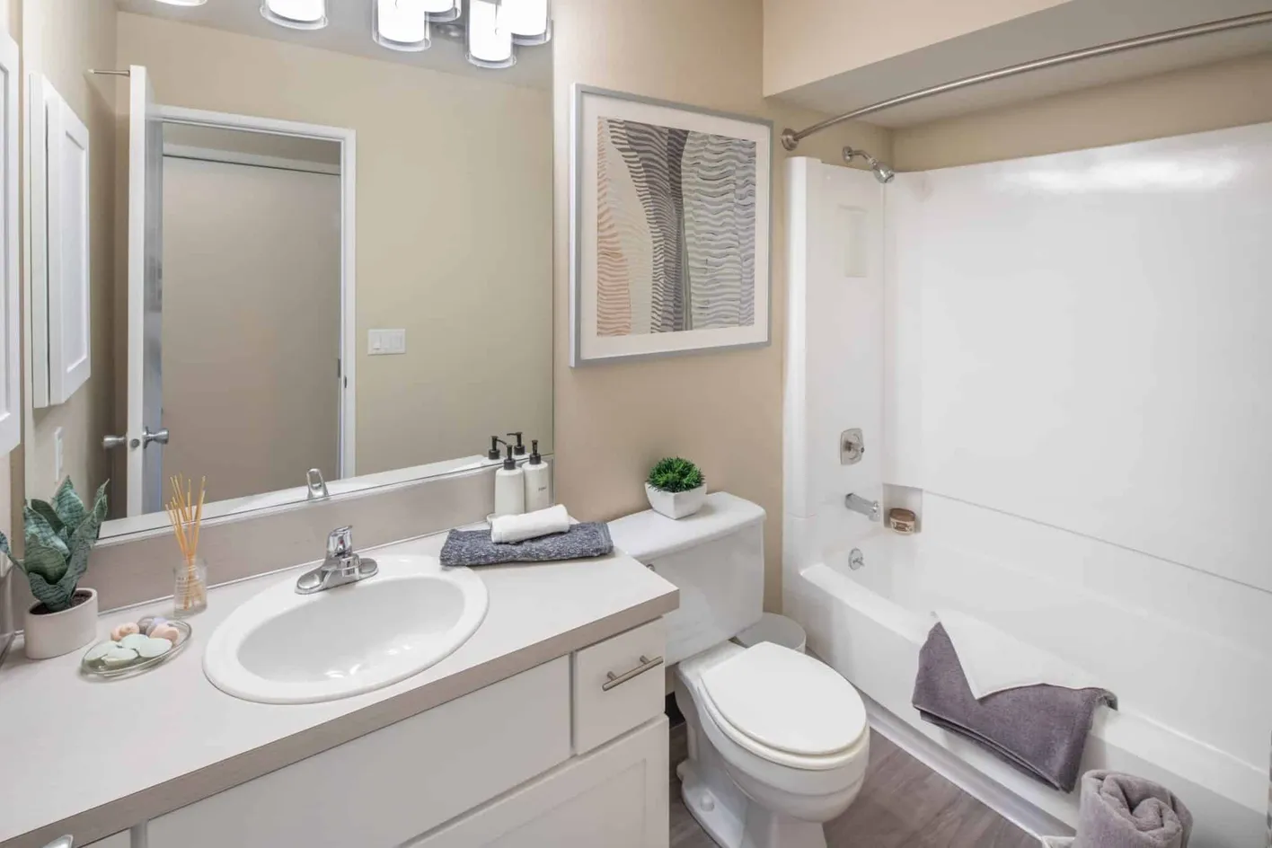 Full bathroom with tub and vanity