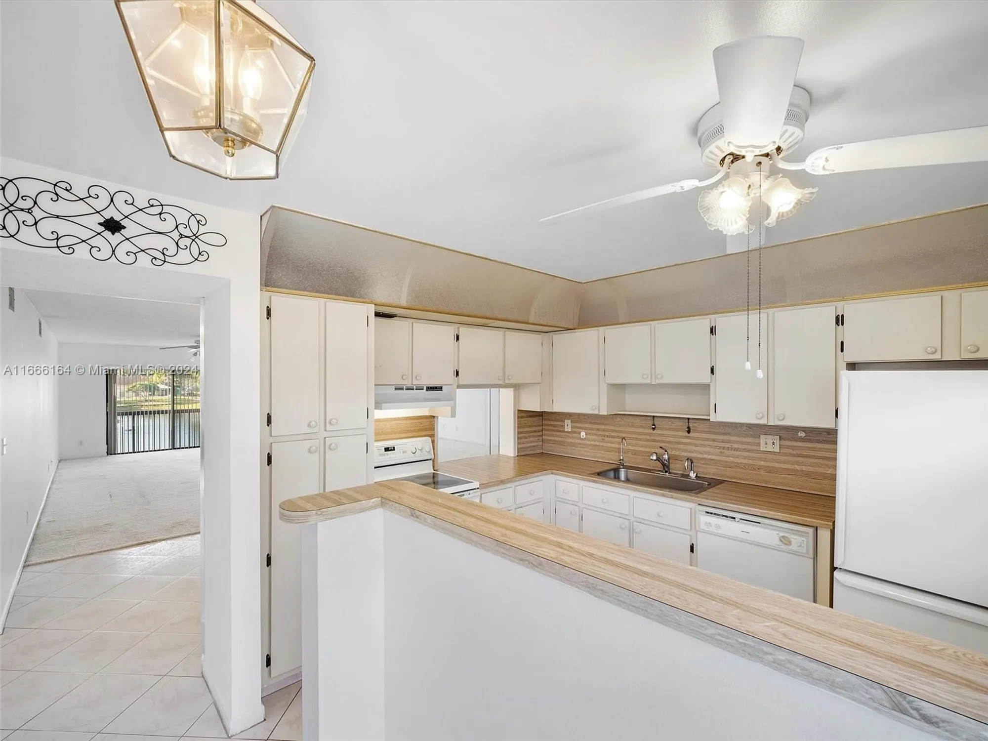 Property Slideshow image 7 of 19 | 6090 n sabal palm blvd 204, Tamarac, FL, 33319