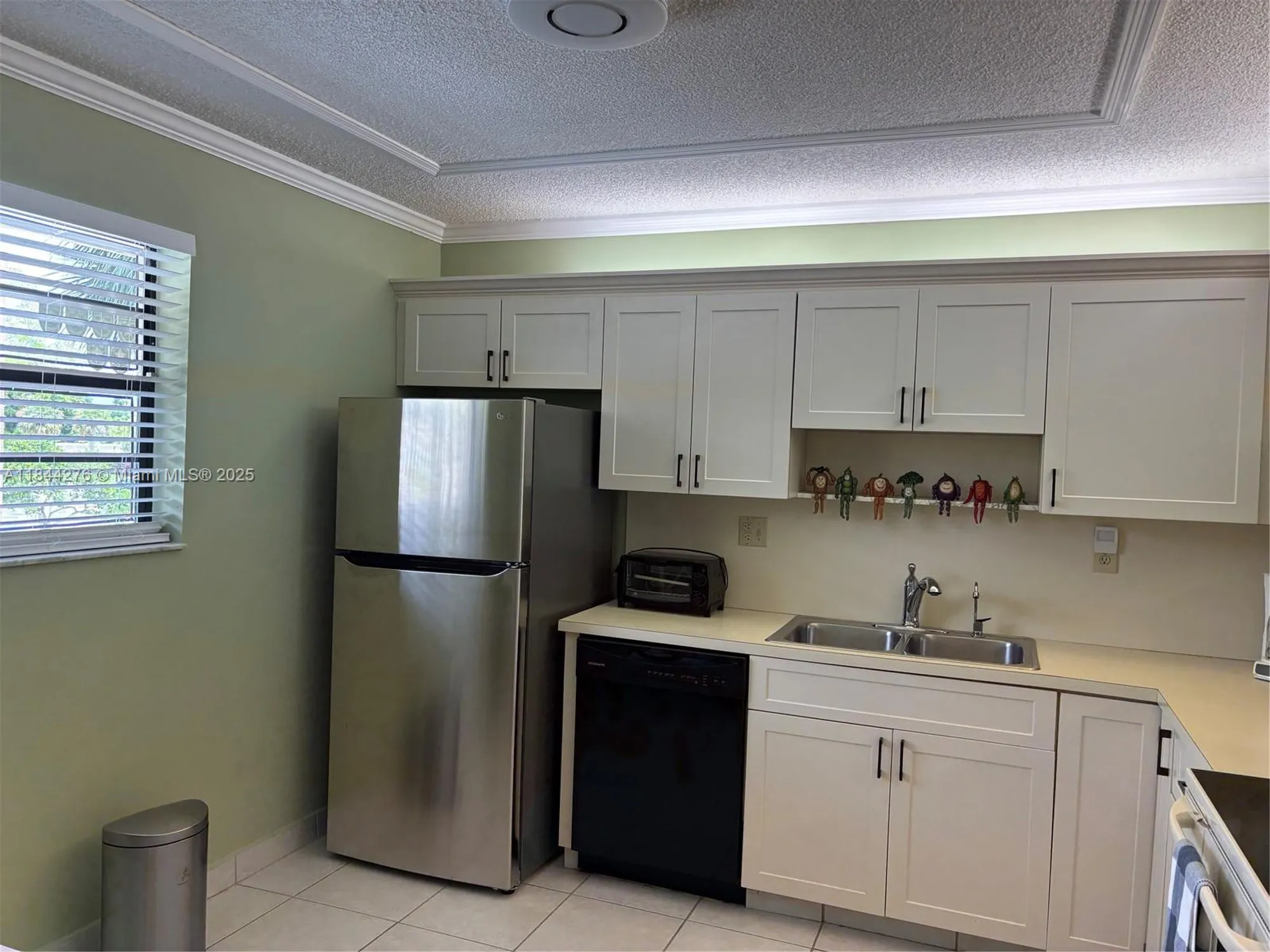 Property Slideshow image 4 of 31 | 4940 e sabal palm blvd 205, Tamarac, FL, 33319