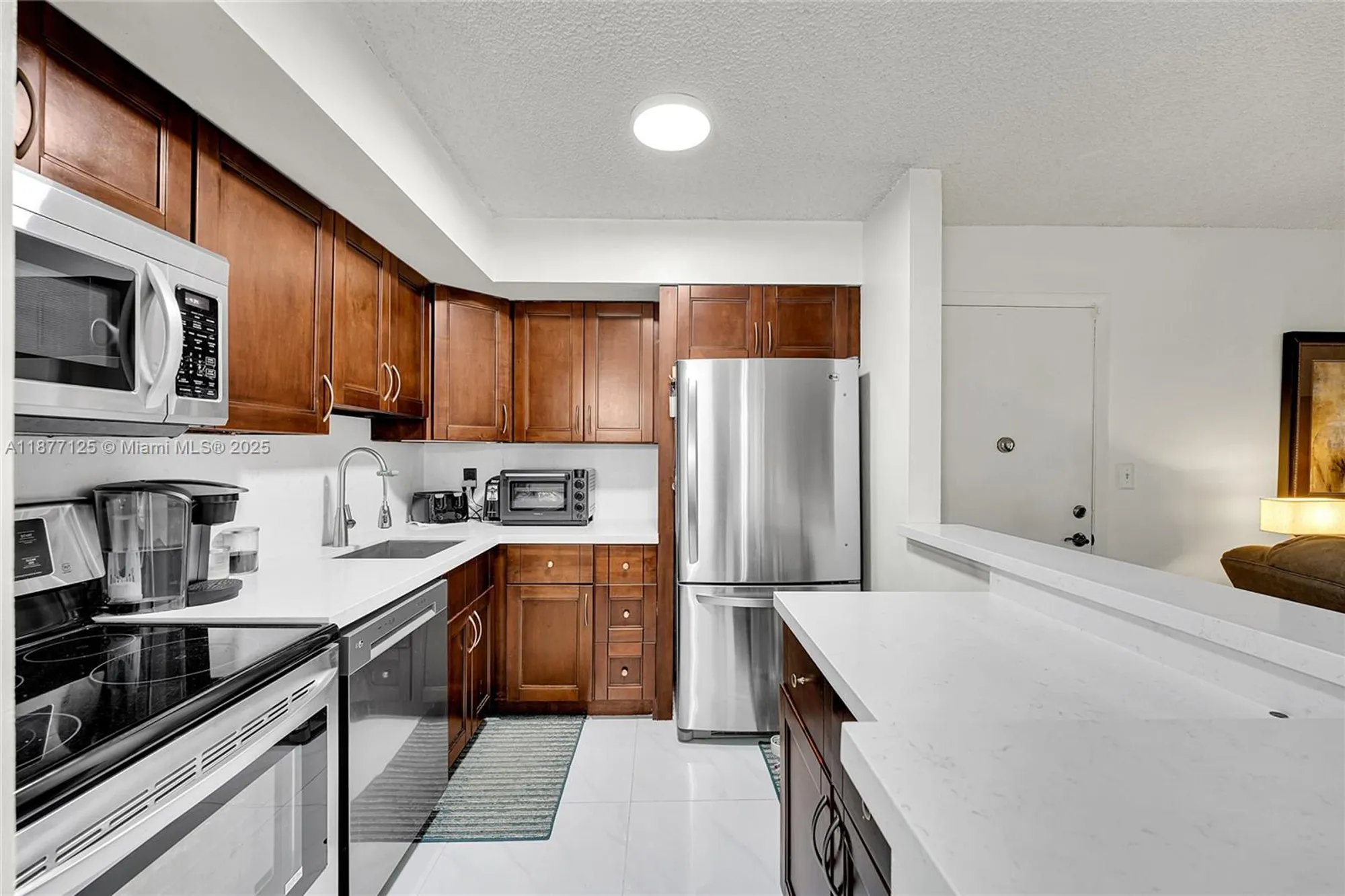Property Slideshow image 1 of 23 | 10401 e clairmont cir # 109, Tamarac, FL, 33321