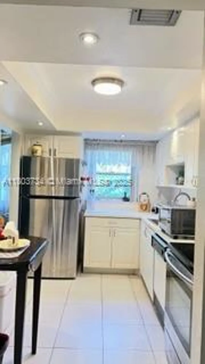 Property Slideshow image 9 of 26 | 1400 saint charles pl l4, Pembroke Pines, FL, 33026