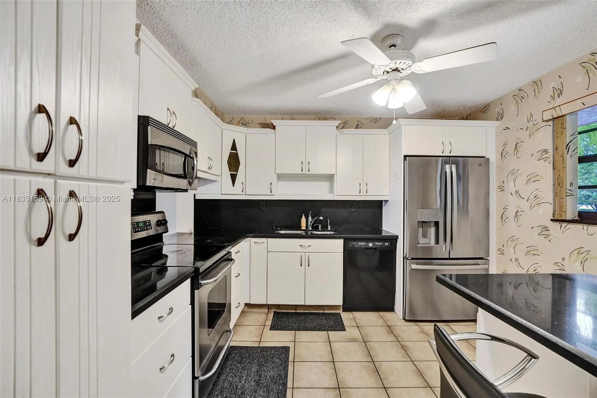 Property Slideshow image 8 of 37 | 4965 e sabal palm blvd 207, Tamarac, FL, 33319