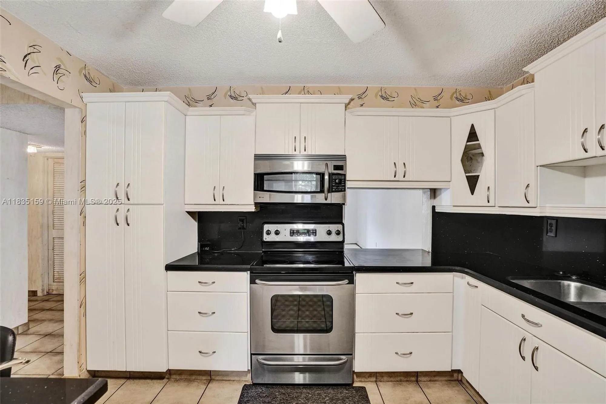 Property Slideshow image 9 of 37 | 4965 e sabal palm blvd 207, Tamarac, FL, 33319