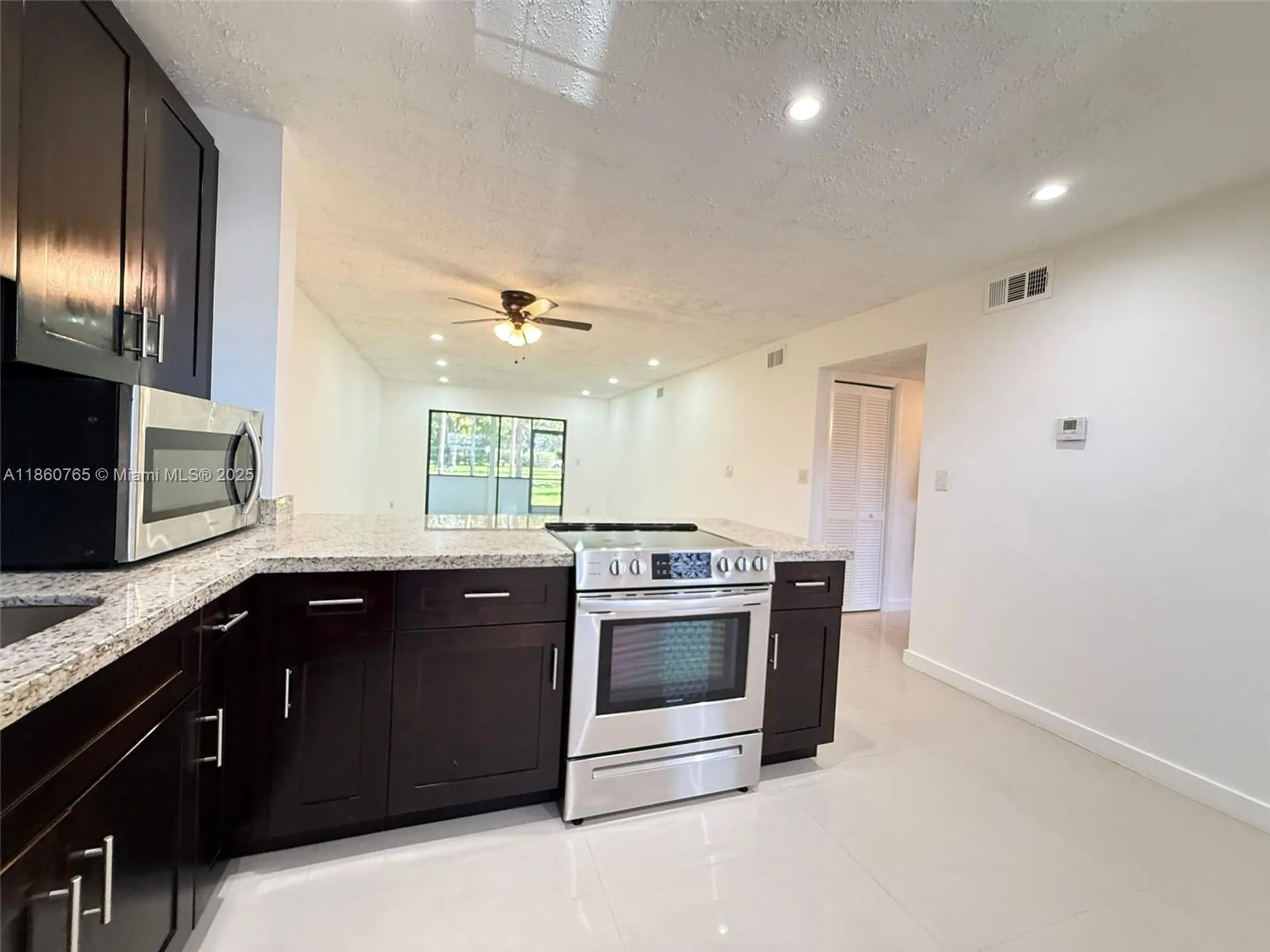 Property Slideshow image 3 of 34 | 6095 n sabal palm blvd apt 103, Tamarac, FL, 33319
