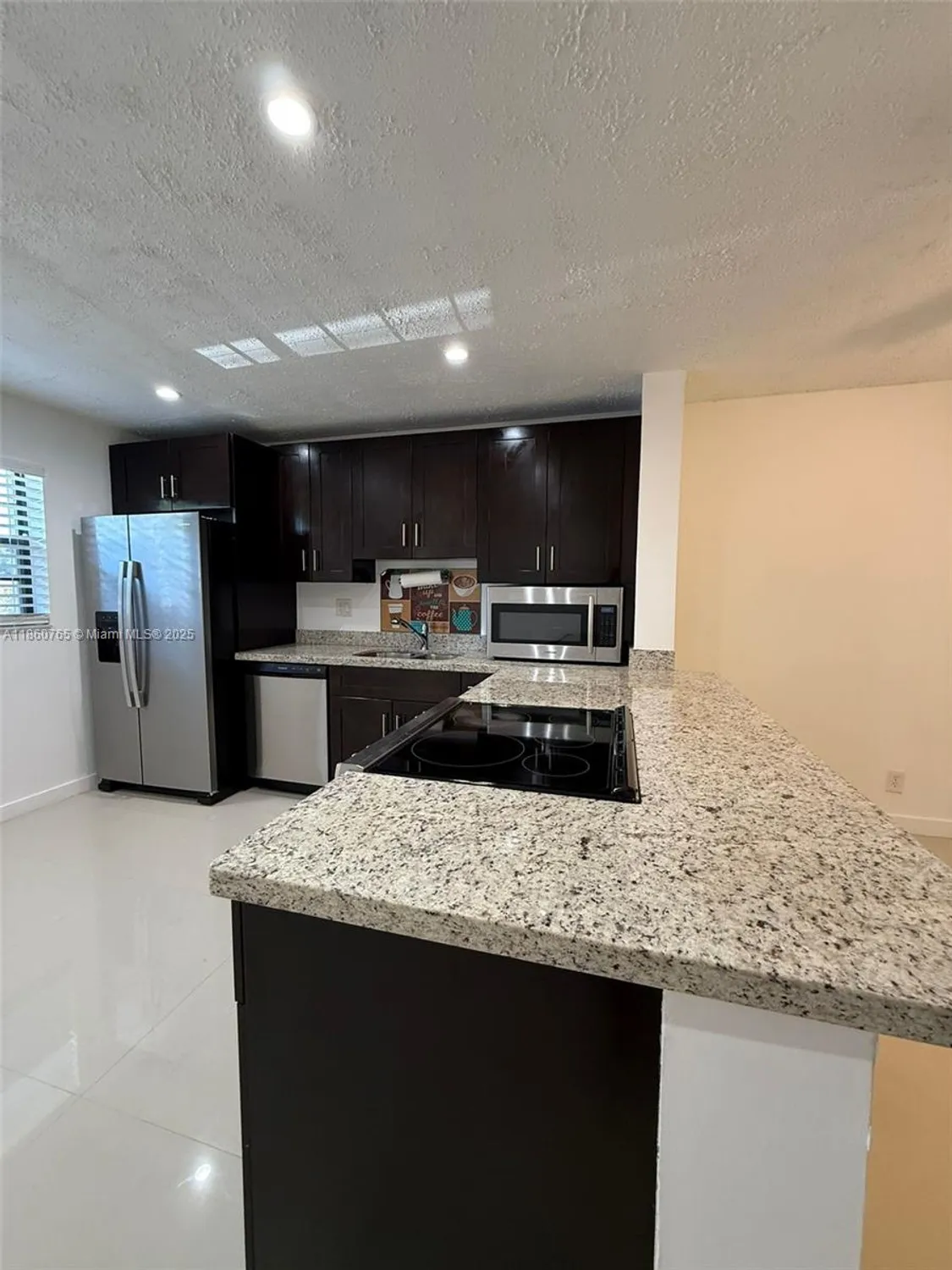 Property Slideshow image 4 of 34 | 6095 n sabal palm blvd apt 103, Tamarac, FL, 33319