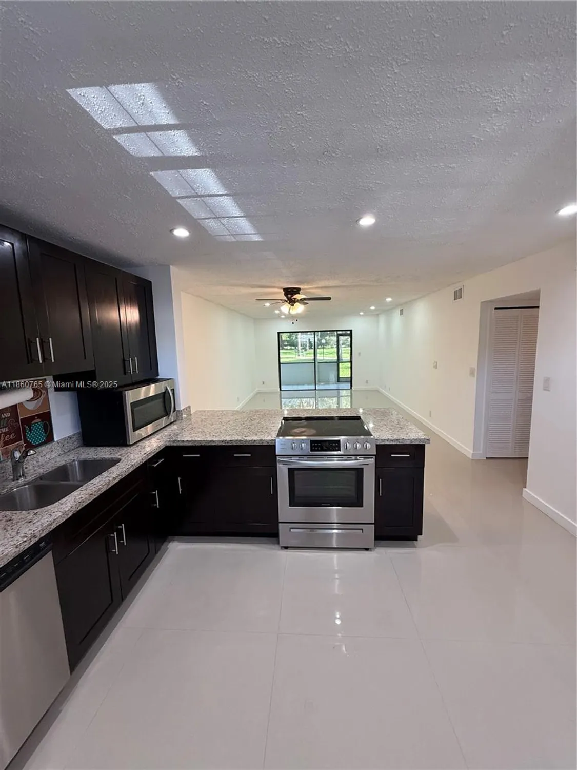 Property Slideshow image 5 of 34 | 6095 n sabal palm blvd apt 103, Tamarac, FL, 33319