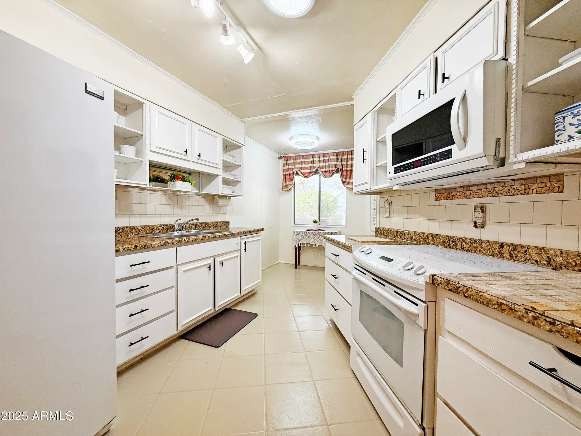 Property Slideshow image 4 of 27 | 11078 w coggins dr, Sun City, AZ, 85351