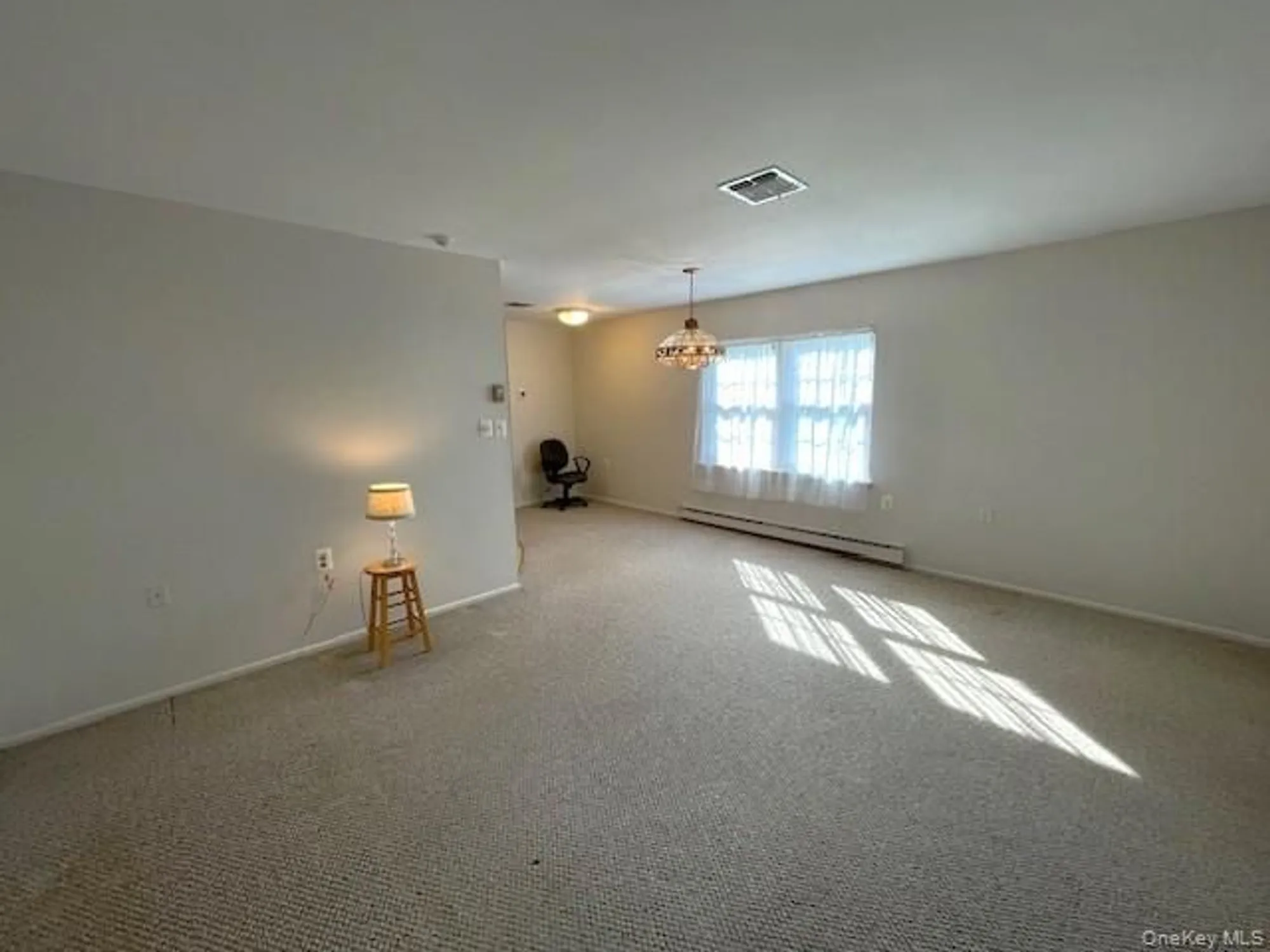 Property Slideshow image 3 of 14 | 120 exmore ct d, Ridge, NY, 11961