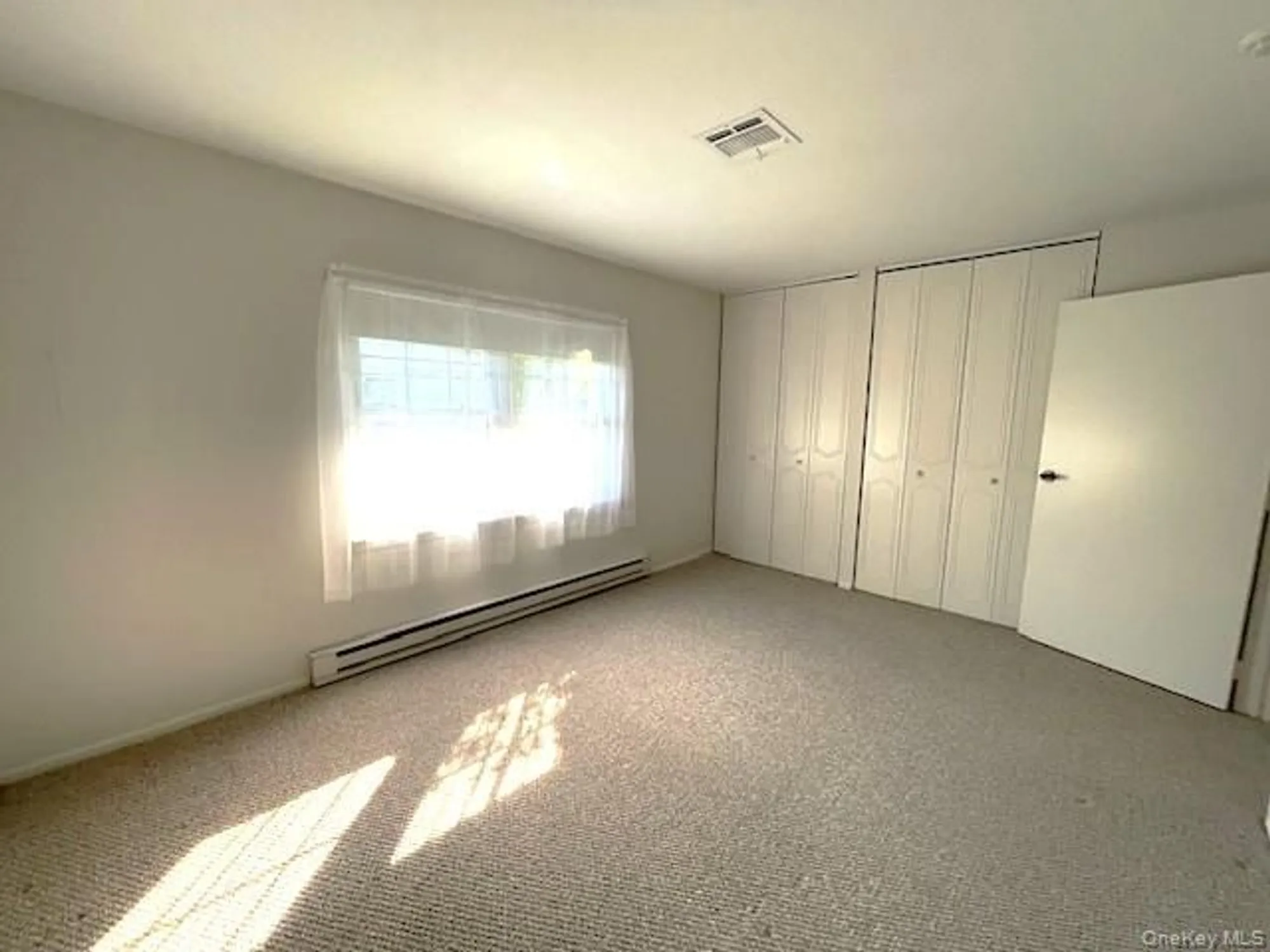 Property Slideshow image 4 of 14 | 120 exmore ct d, Ridge, NY, 11961