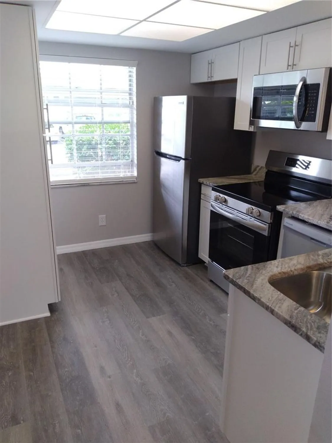 Property Slideshow image 12 of 16 | 1415 doolittle ln 104, Dunedin, FL, 34698