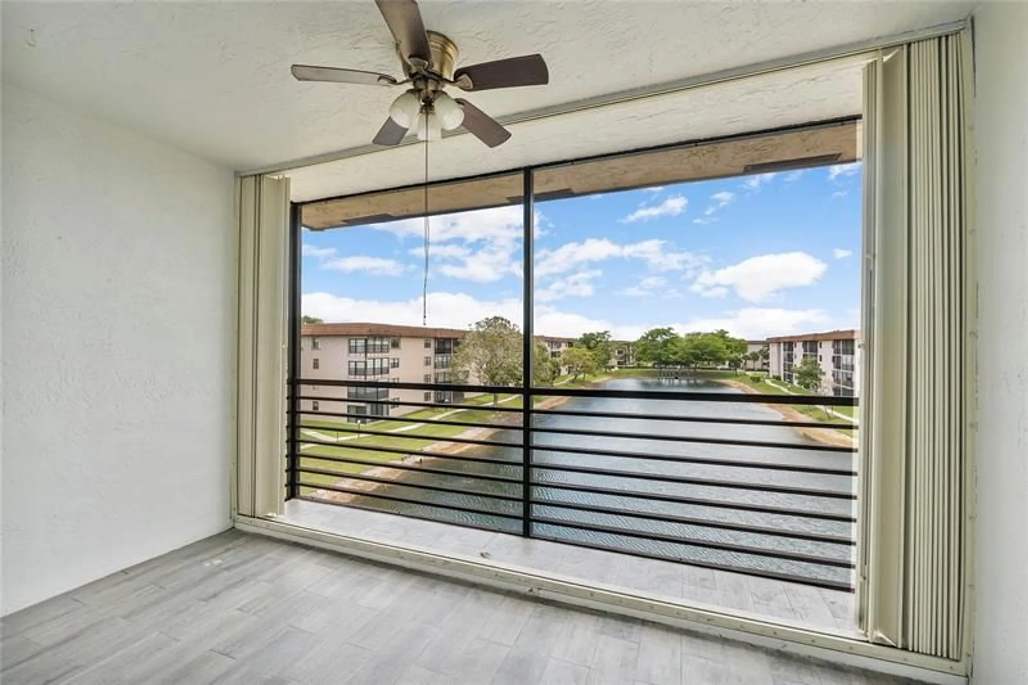 Property Slideshow image 4 of 15 | 4930 e sabal palm blvd apt 402, Tamarac, FL, 33319