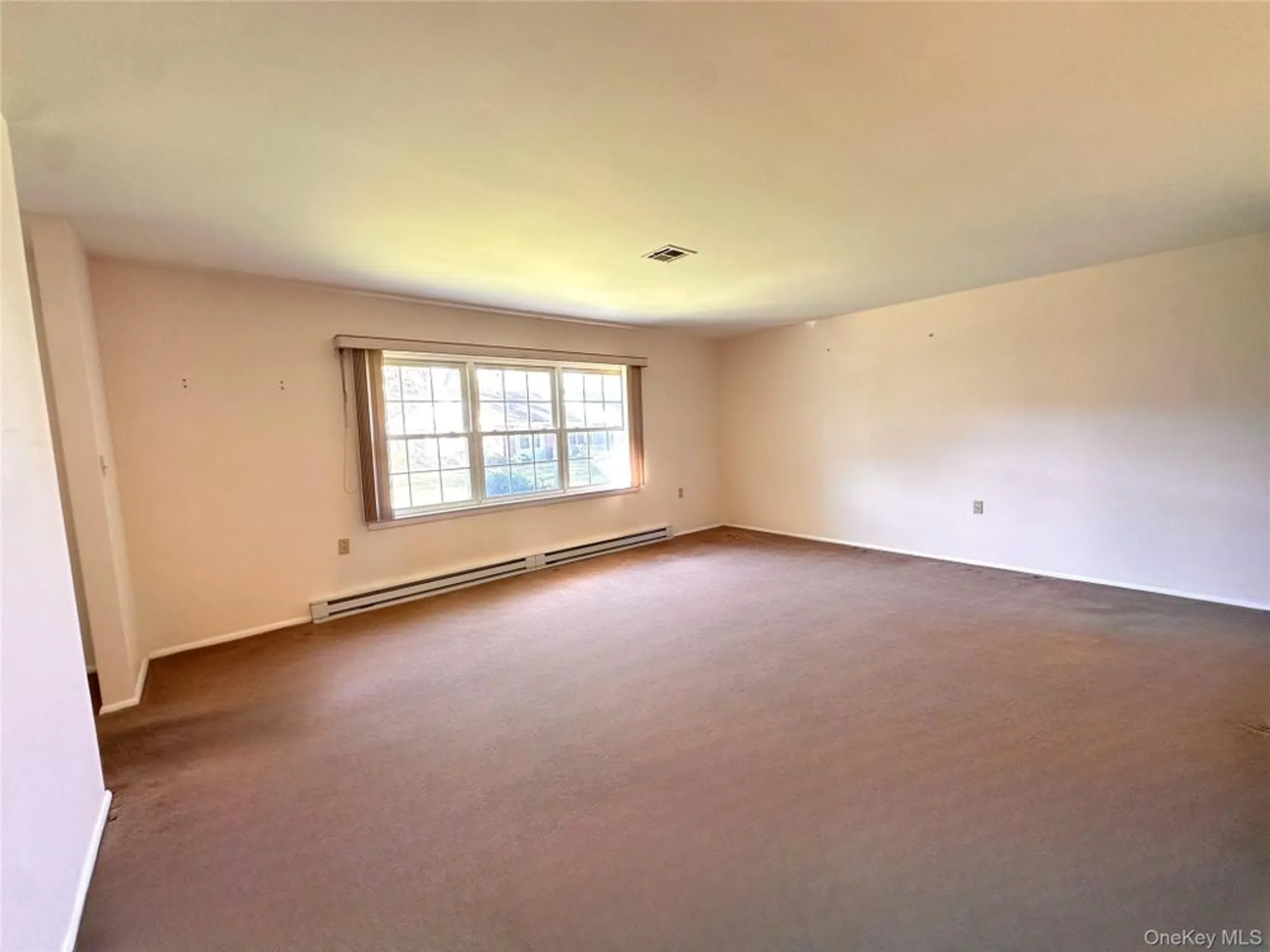 Property Slideshow image 4 of 15 | 215 woodbridge dr a, Ridge, NY, 11961