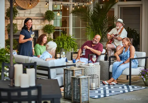 Residents enjoying an outdoor gathering space with live music