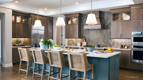 Designer kitchen with oversized island and custom cabinetry