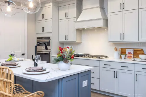 Modern kitchen with quartz countertops and stainless appliances